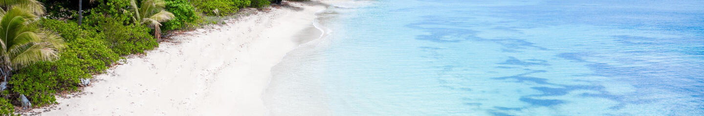 couple walking on a beach in Fiji