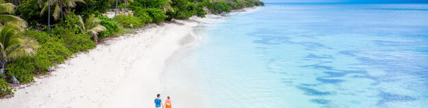 couple walking on a beach in Fiji