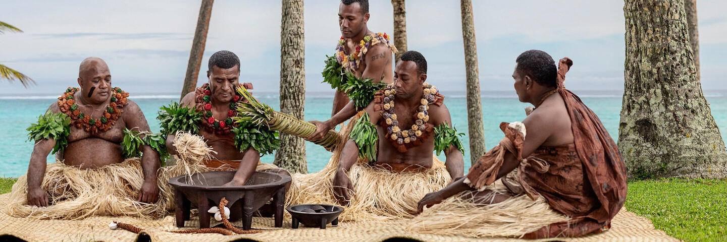 Group of Fijians celebrating a ceremony with Kava