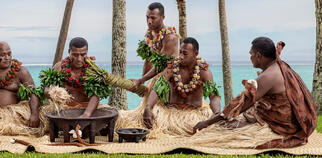 Group of Fijians celebrating a ceremony with Kava