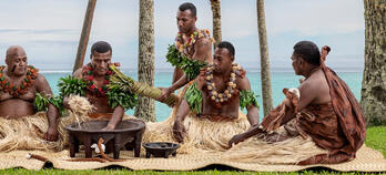 Group of Fijians celebrating a ceremony with Kava