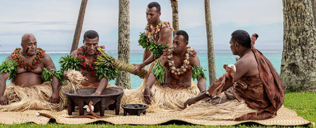 Group of Fijians celebrating a ceremony with Kava