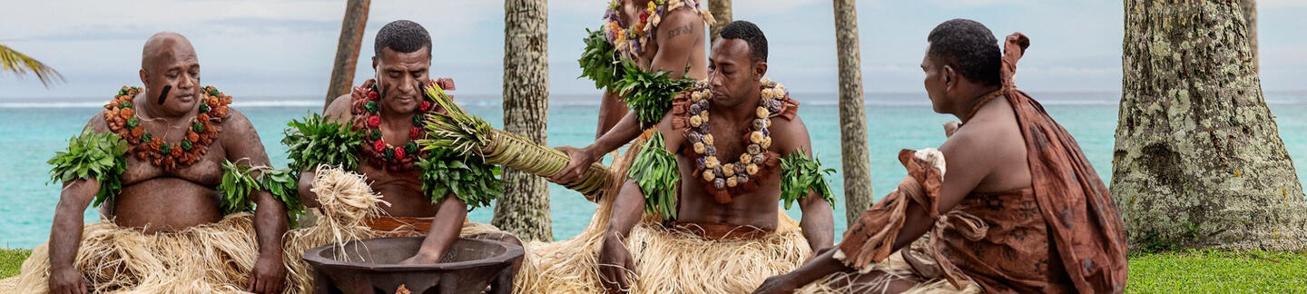 Group of Fijians celebrating a ceremony with Kava