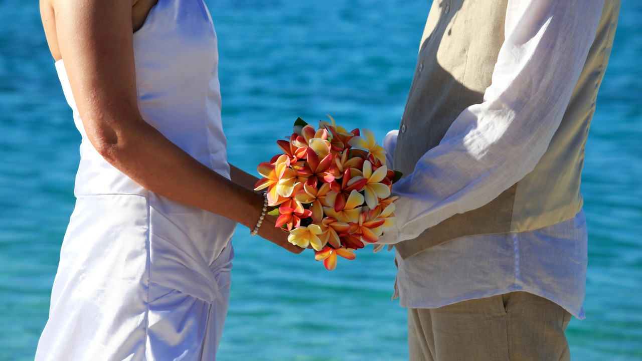 Wedding ceremony with couple Couple holding flowers