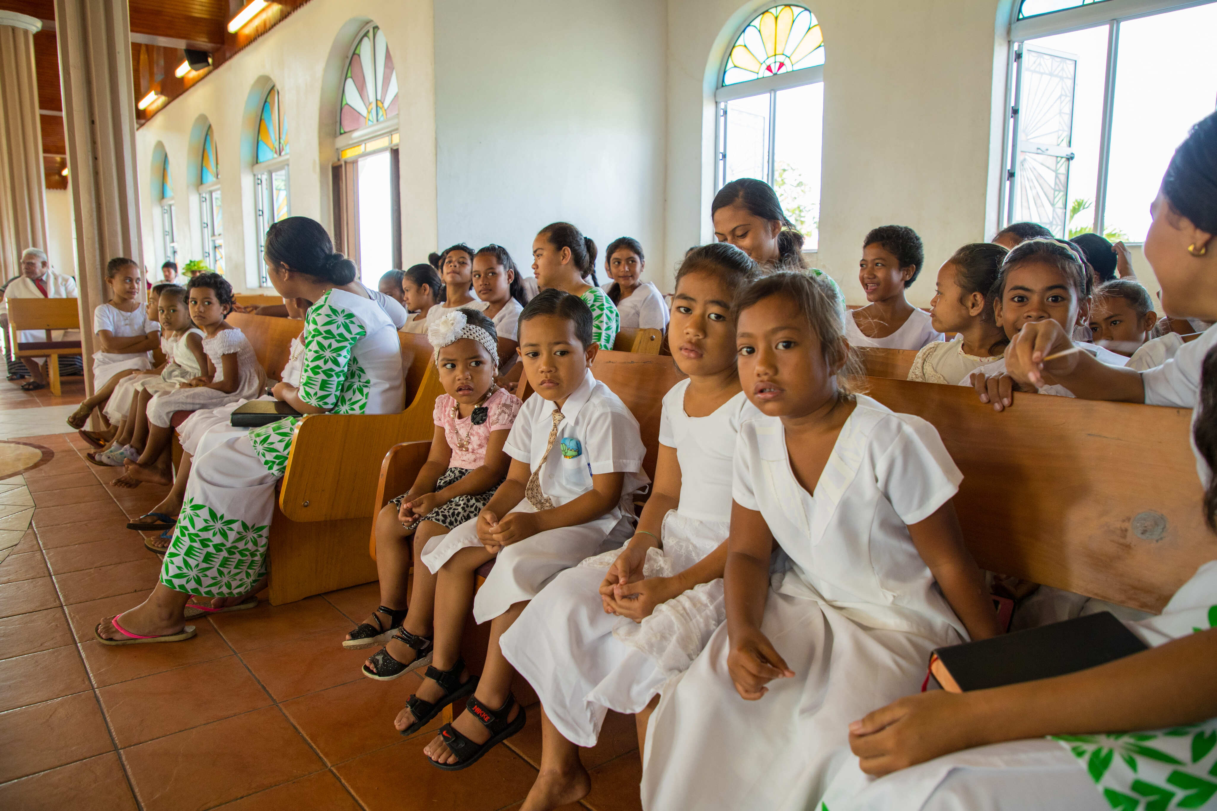 kids in church in Samoa dressed in white