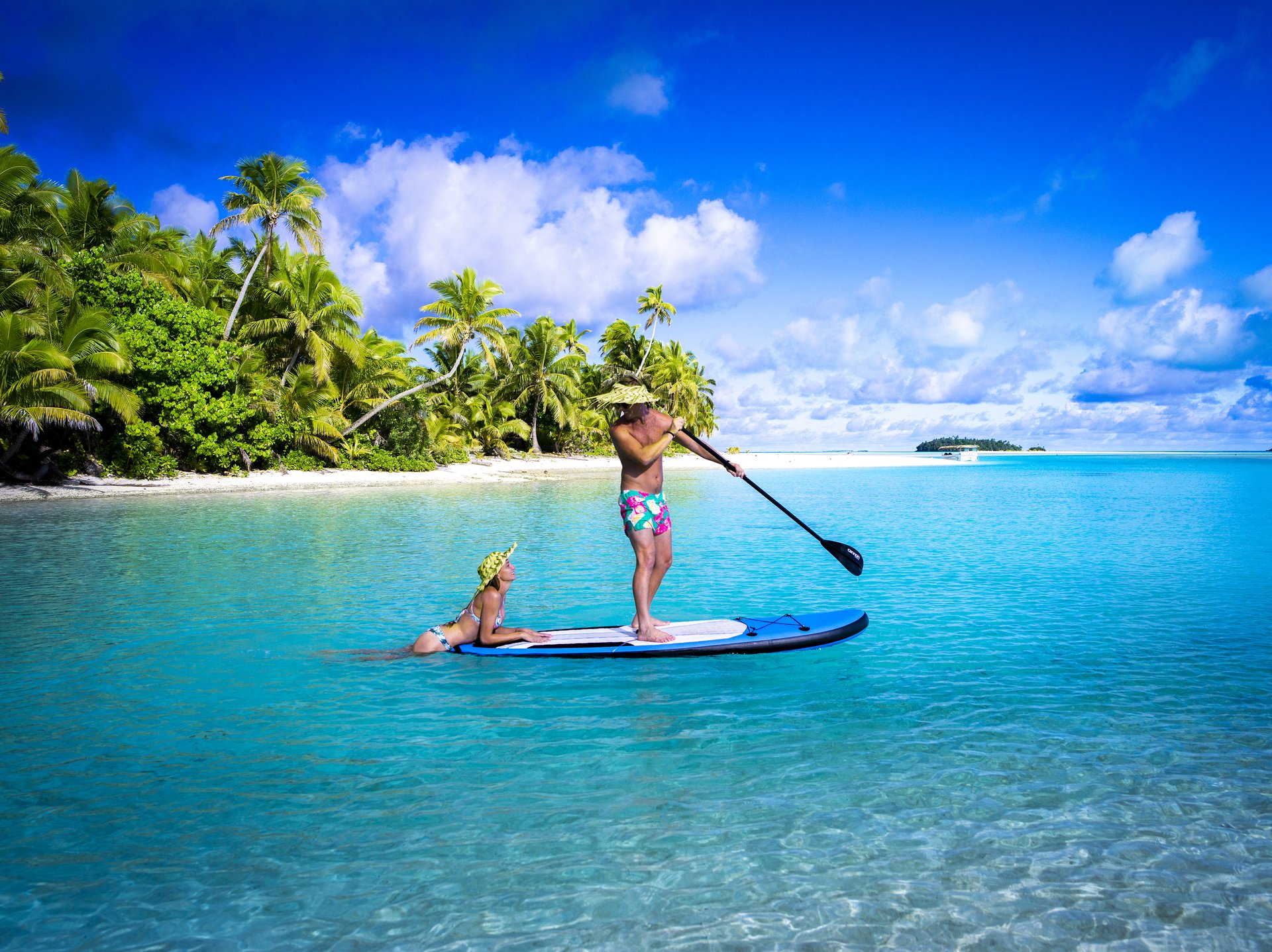 Couple on a SUP in Aitutaki Lagoon