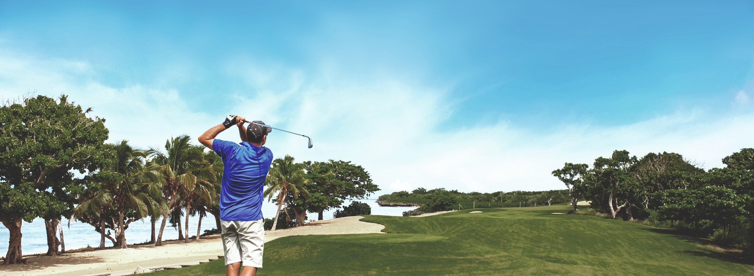 Man playing golf on beautiful green in Fiji