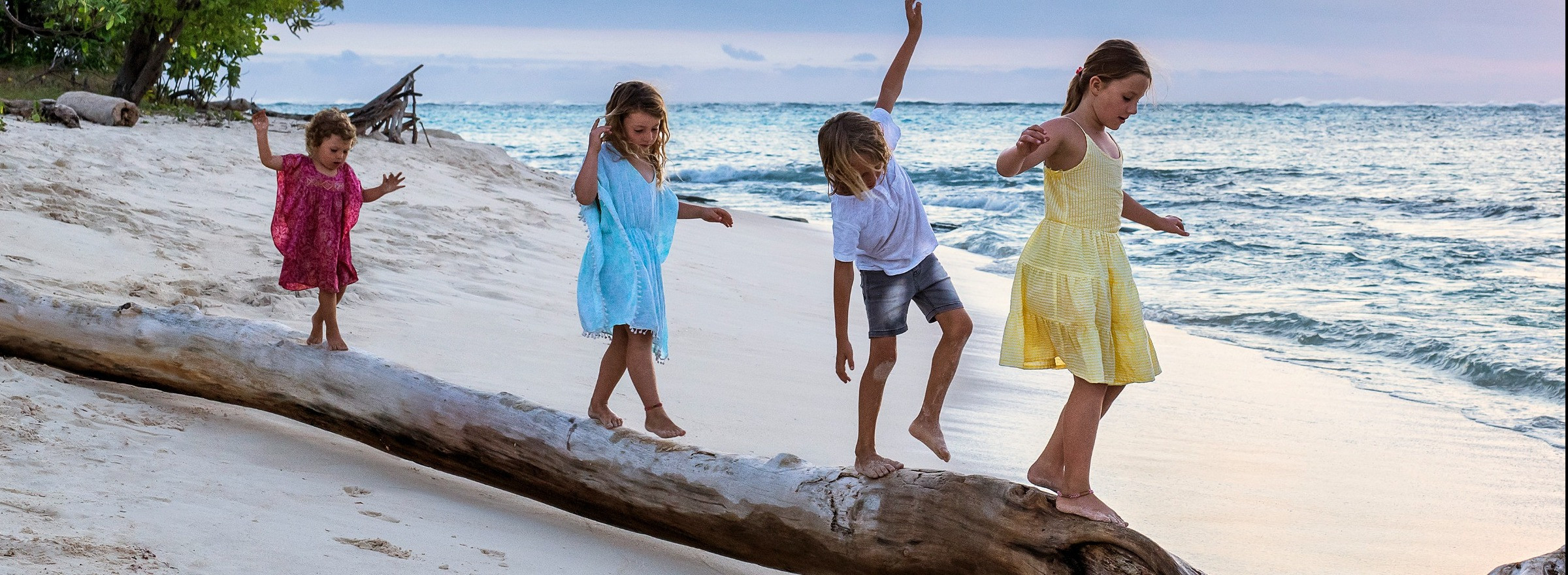 image of four children playing on the beach in Fiji