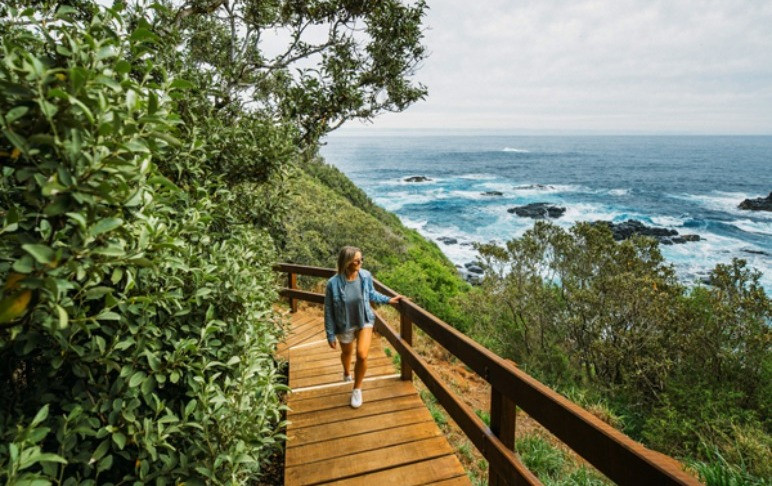 woman walking on boardwalk Norfolk Island