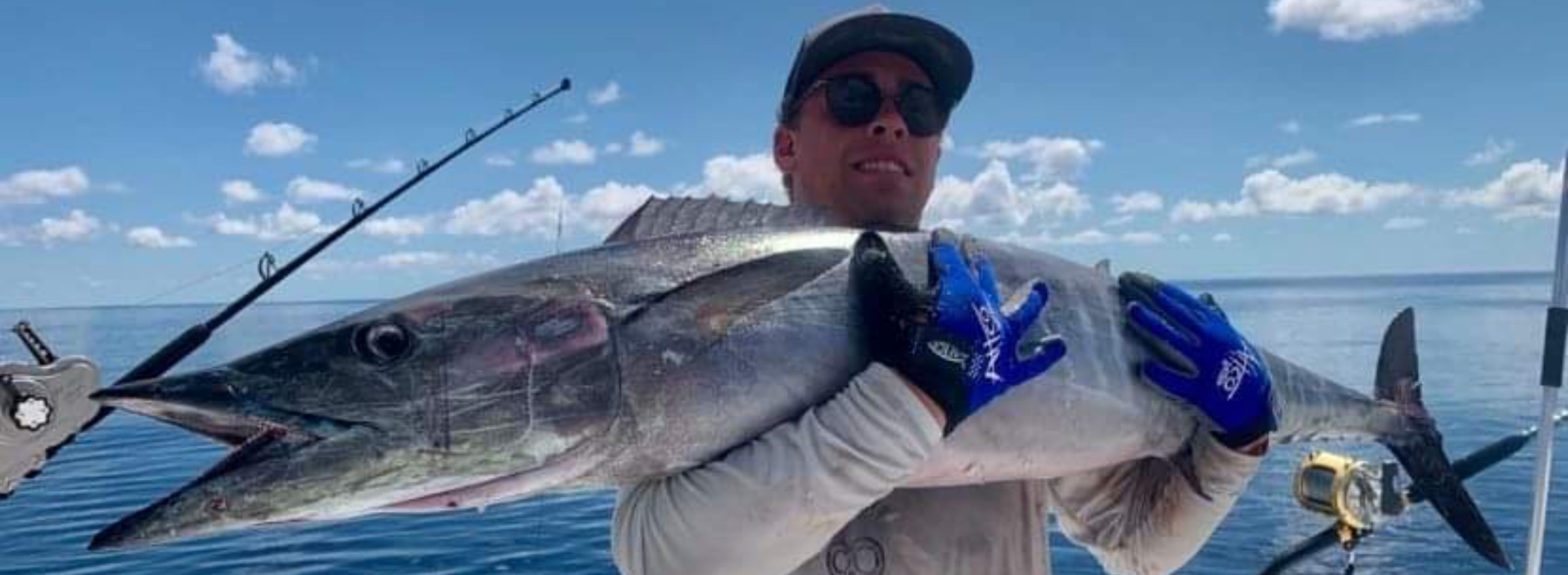 image of man holding a large fish