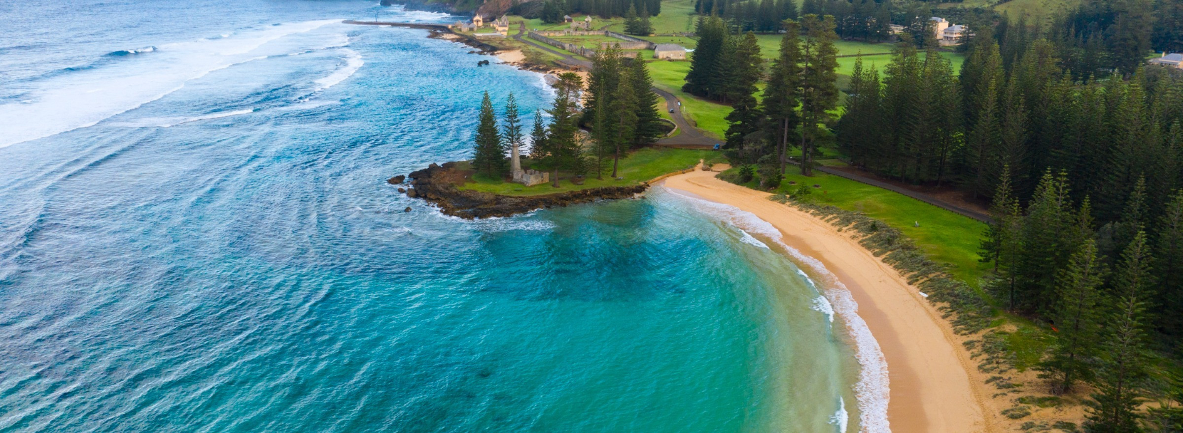 Emily Bay on Norfolk Island, golden sand beach with turquoise blue water