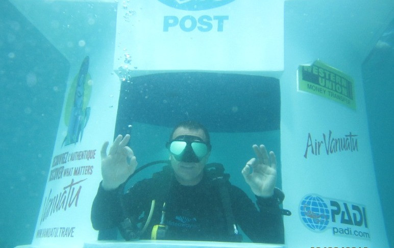 Hideaway Island Vanuatu underwater post office image of man